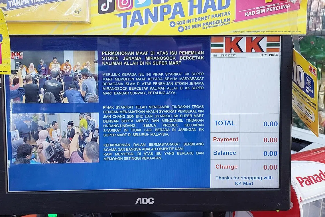 An apology over the "socks issue" is seen on a cash register at a KK Mart outlet in Malaysia. 
