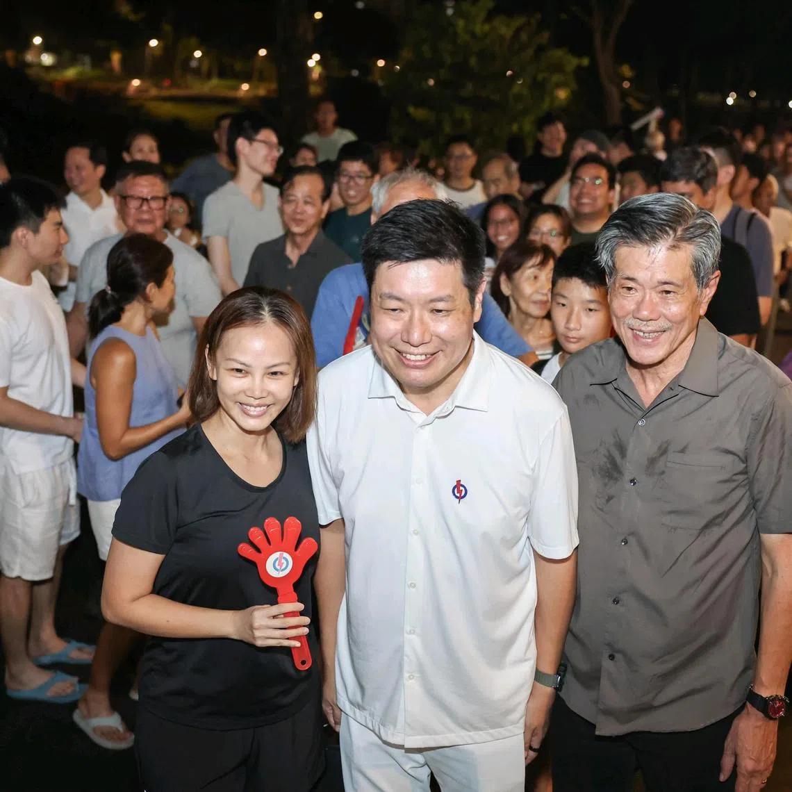 ST20250501_202597200992/gcpotong01/Brian Teo/PAP candidate for Potong Pasir SMC Alex Yeo taking a photo with supporters after the end of the party's rally at St Andrew's Junior College on May 1, 2025.ST PHOTO: BRIAN TEO