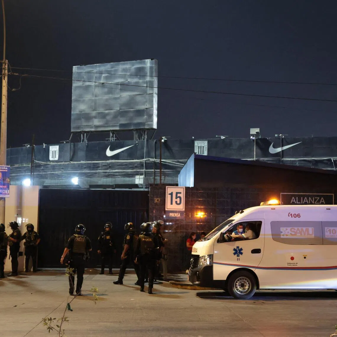 An ambulance is seen at the entrance of the Alejandro Villanueva Stadium after an accident in the stands, where Alianza Lima's fans were cheering and waving flags for their team on the eve of the match against Universitario in the Peruvian capital on April 3, 2026.
