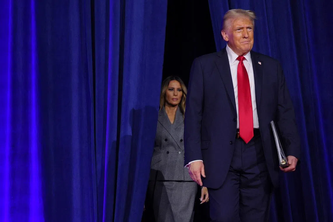 Republican presidential nominee and former U.S. President Donald Trump and his wife Melania take the stage for his election night rally at the Palm Beach County Convention Center in West Palm Beach, Florida, U.S., November 6, 2024. REUTERS/Brian Snyder/File Photo