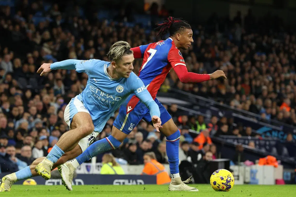 Michael Olise of Crystal Palace in action against Jack Grealish of Manchester City  during the Premier League game on Dec 16.