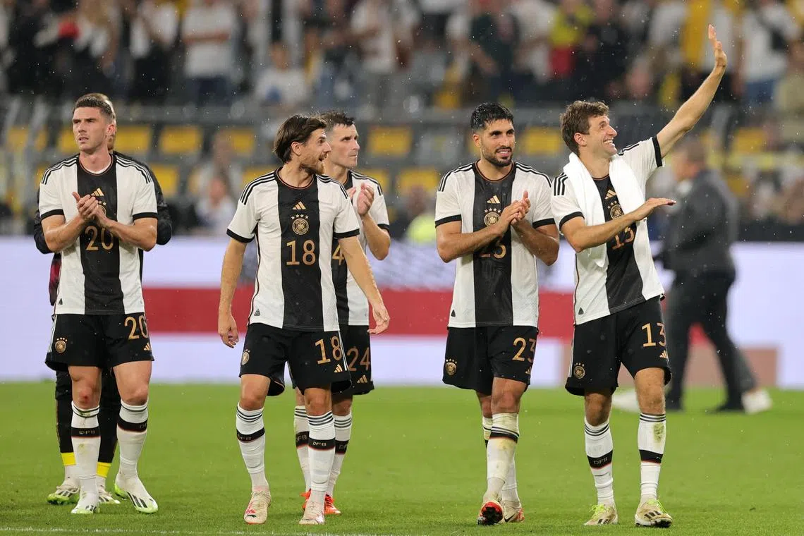 German players celebrate after winning their friendly against France.