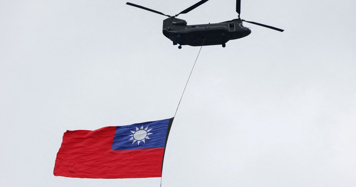 Giant Taiwan flag flies from helicopter for national day, defying Beijing