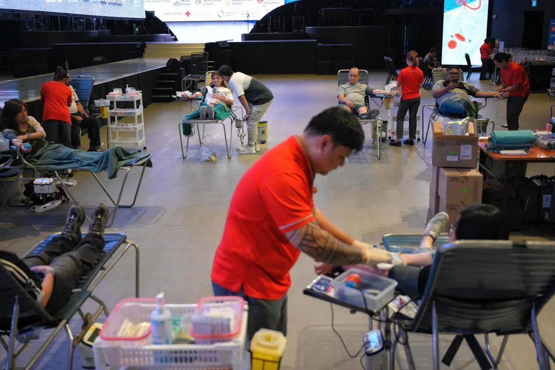 People donate blood during the 6th Interfaith Blood Donation Drive held at the Heart of God Church on Oct 30, 2024.
