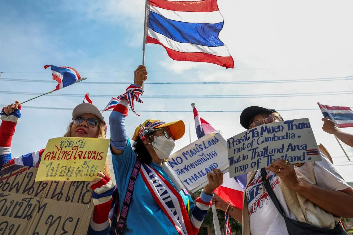 Royalist activists hold placards as they protest in front of the Royal Embassy of Cambodia, following a recent clash at the Thailand-Cambodia border on May 28, 2025, in Bangkok, Thailand, June 6, 2025. REUTERS/Chalinee Thirasupa