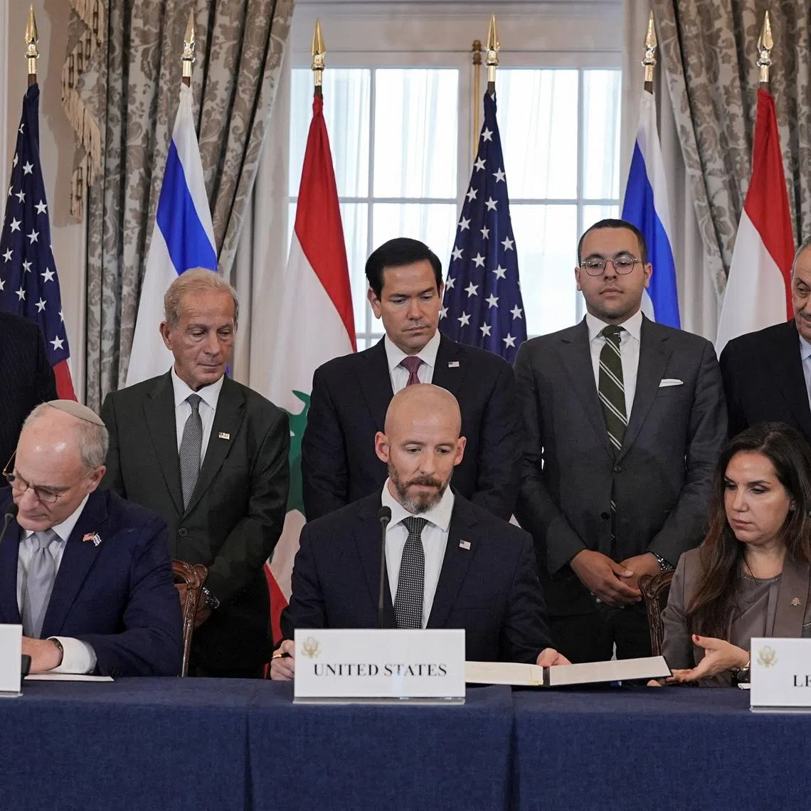 US Secretary of State Marco Rubio looking on as State Department Counsellor Daniel Holler, Israel’s Ambassador to the US Yechiel Leiter and Lebanon’s Ambassador to the US Nada Hamadeh sign the framework deal in the US on June 26.
