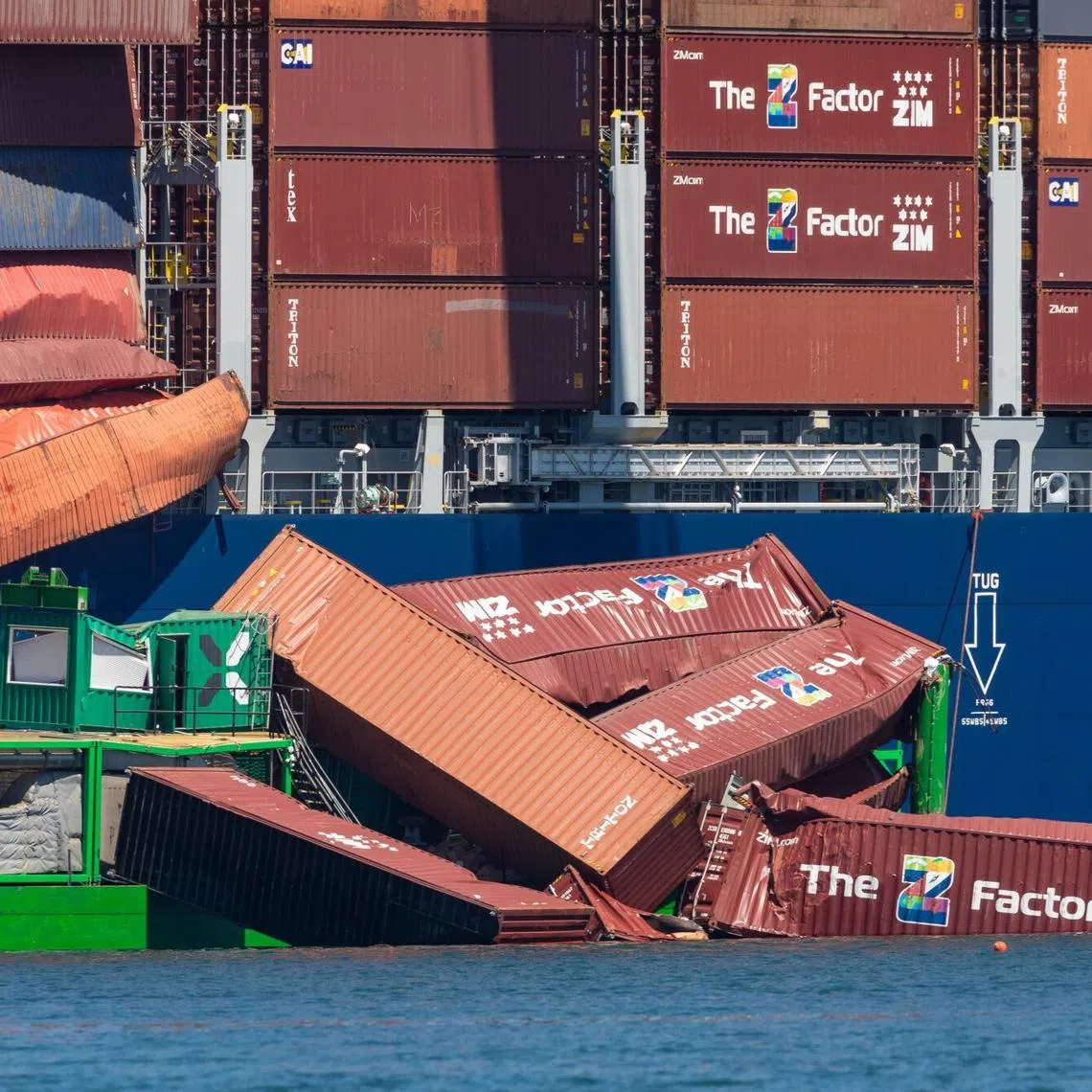 Fallen shipping containers in the water near the Mississippi container ship at the Port of Long Beach, in Long Beach, California, on Sept 9.