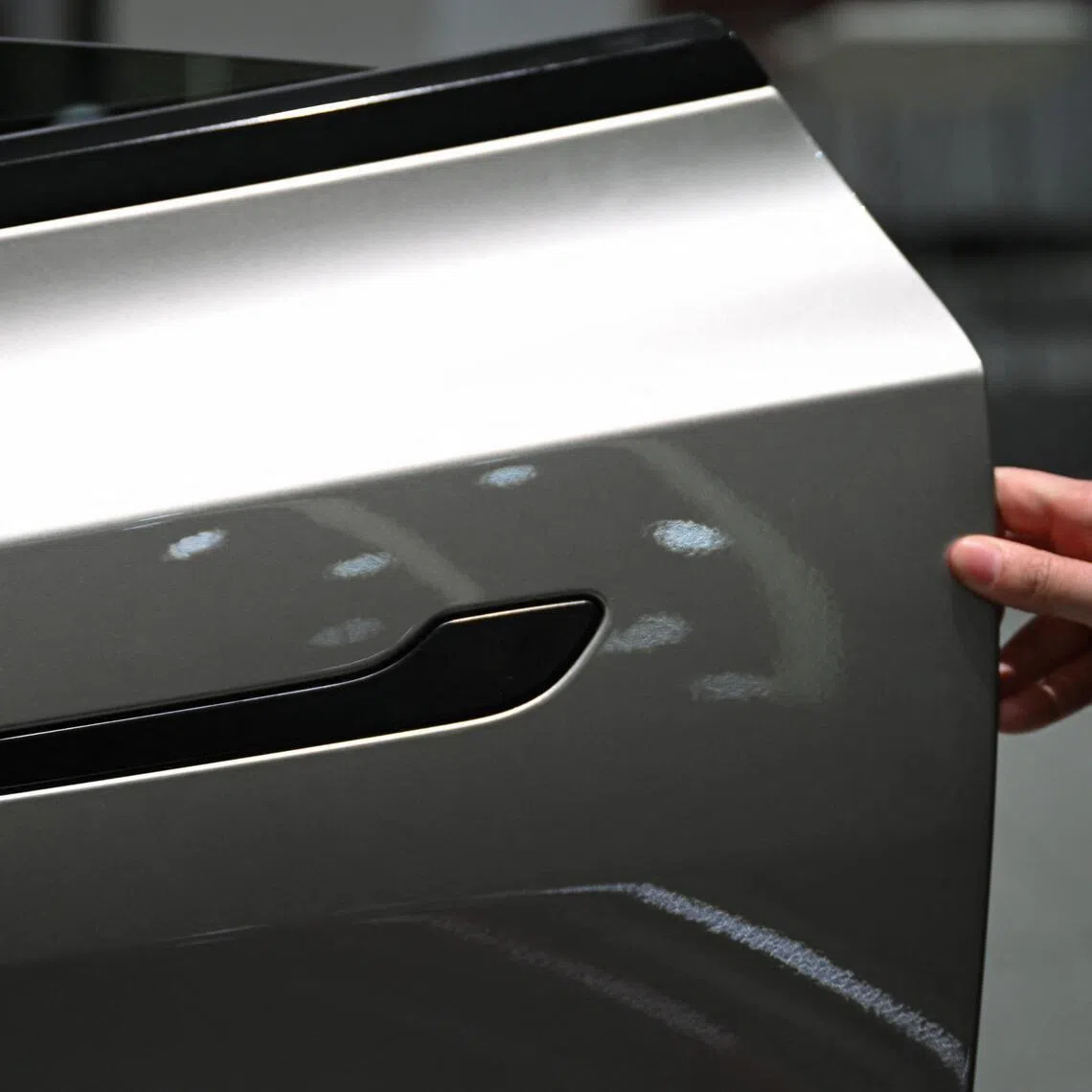 Concerns over the safety of flush car door handles – a design popularised by EV manufacturer Tesla – have risen after a spate of deadly incidents globally.