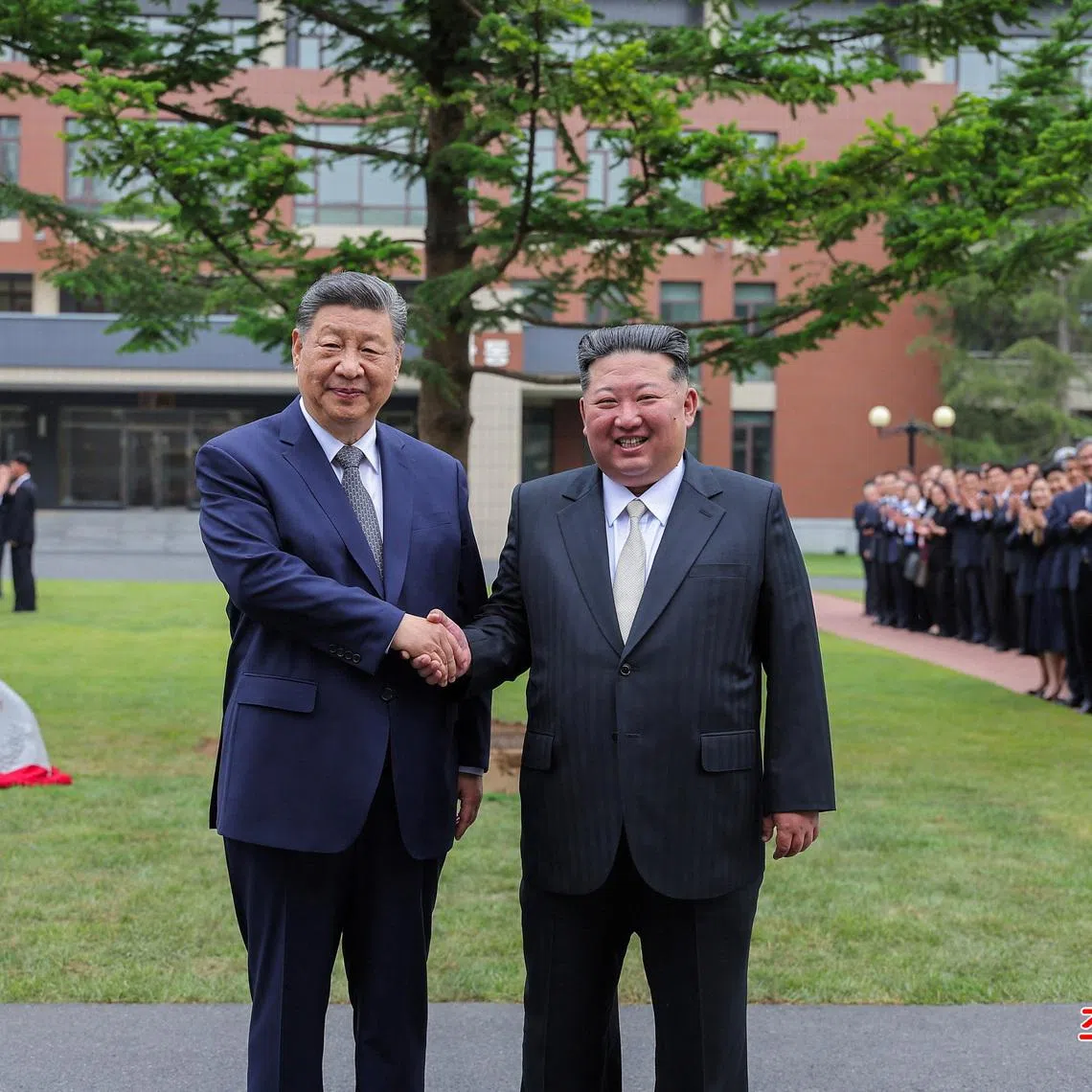 Chinese President Xi Jinping and North Korean leader Kim Jong Un pose for a picture as they visit the Central Cadres Training School of the Workers' Party, in Pyongyang, North Korea, June 9, 2026. KCNA via REUTERS