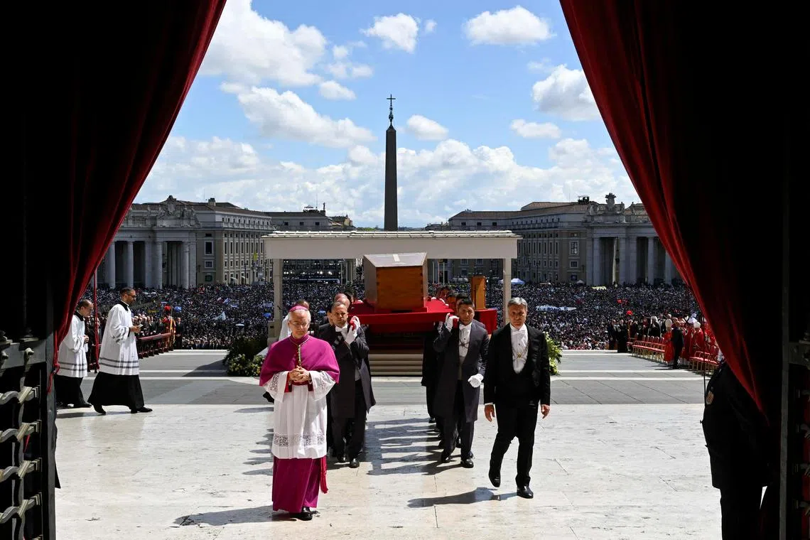 Pallbearers carrying the coffin of Pope Francis on the day of his funeral Mass in St. Peter's Square at the Vatican, on April 26, 2025.