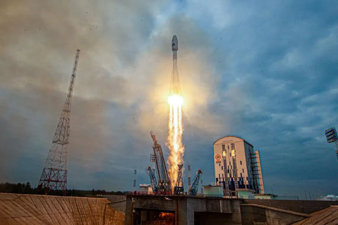 FILE PHOTO: A Soyuz-2.1b rocket booster with a Fregat upper stage and the lunar landing spacecraft Luna-25 blasts off from a launchpad at the Vostochny Cosmodrome in the far eastern Amur region, Russia, August 11, 2023. Roscosmos/Vostochny Space Centre/Handout via REUTERS/ File Photo