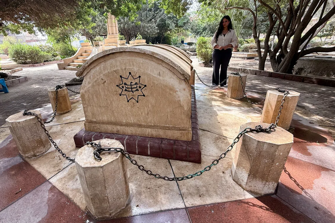 Egyptian Baha'i architect Joumana Labib stands in a cemetery dedicated to members of the Baha'i community in the Al-Basateen district of Cairo, Egypt, October 2, 2026. Picture taken with a mobile phone. REUTERS/Stringer