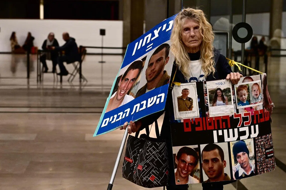 A protester takes part in a Tel Aviv rally for supporters and relatives of Israeli hostages held in Gaza since the Oct 7 attack by Hamas militants.
