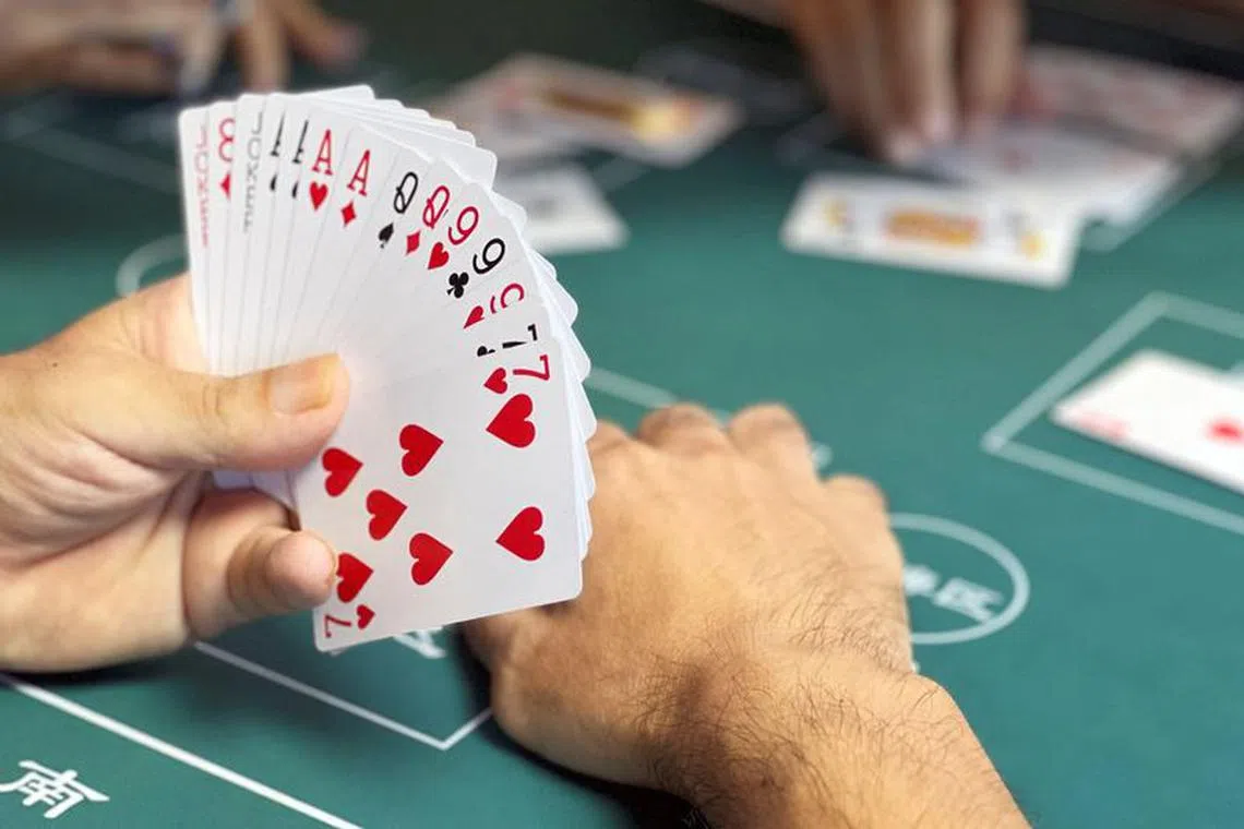 The game, called guandan, has become a key way for businesspeople, bankers and government officials to socialise.