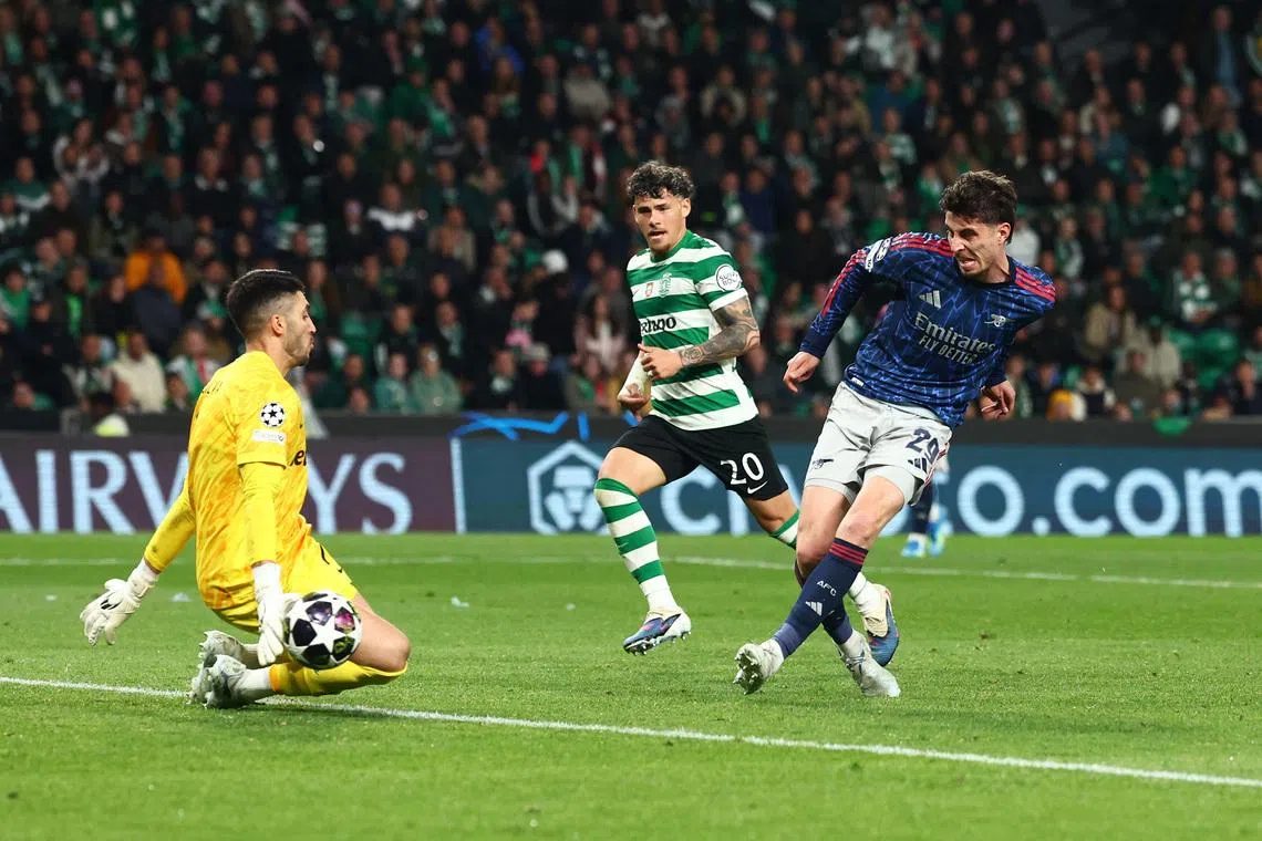 Soccer Football - UEFA Champions League - Quarter Final - First Leg - Sporting CP v Arsenal - Estadio Jose Alvalade, Lisbon, Portugal - April 7, 2026 Arsenal's Kai Havertz scores their first goal past Sporting CP's Rui Silva. REUTERS/Pedro Nunes
