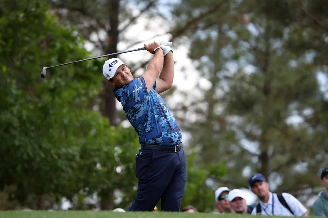 Golf - The Masters - Augusta National Golf Club, Augusta, Georgia, U.S. - April 11, 2025 Patrick Reed of the U.S. hits his tee shot on the 4th hole during the second round REUTERS/Pilar Olivares
