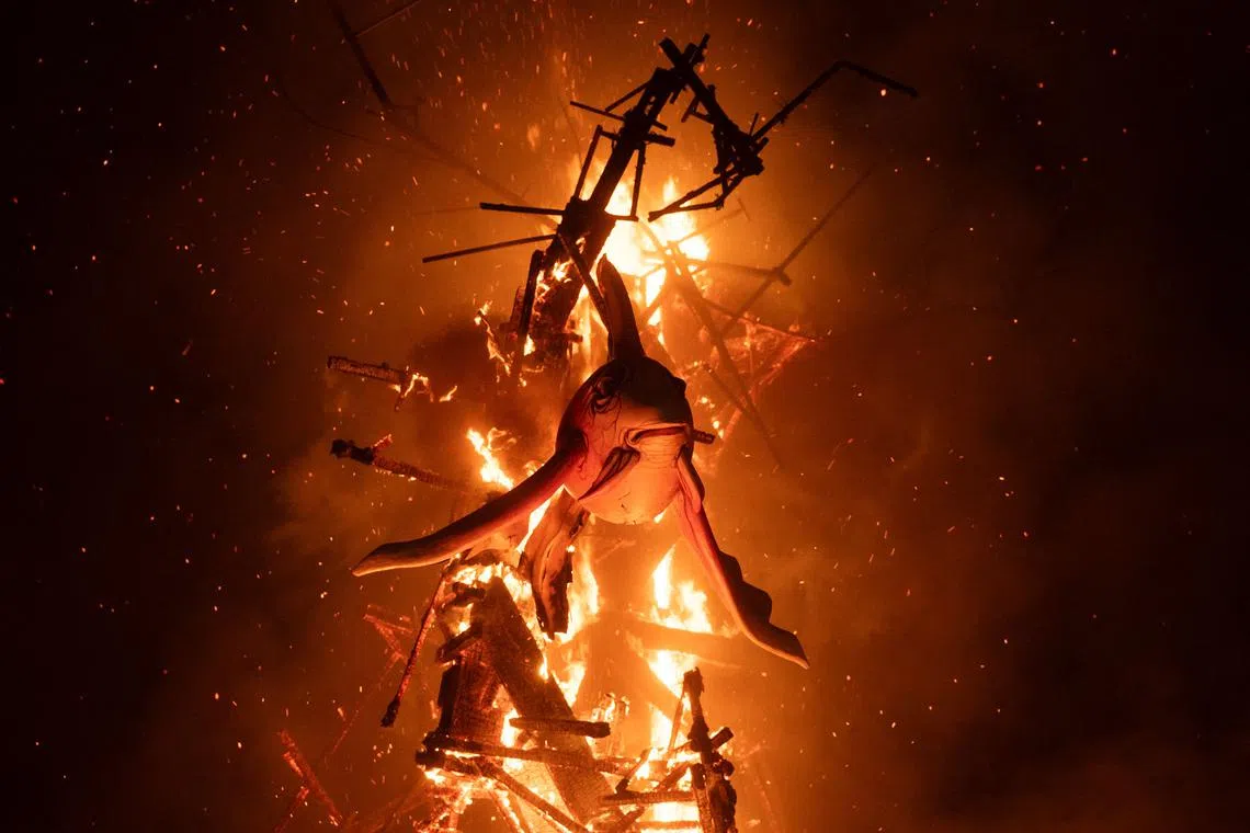 'Ninots' (cardboard figurines whose name literally means 'dolls' in Valencian), burning on the final night of the Fallas Festival in Valencia, on March 19, 2025. 