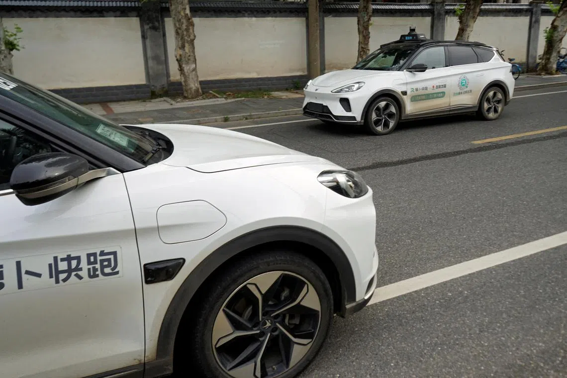A driverless car by Apollo Go, Baidu's robotaxi service, drives past in Wuhan. The technology firm is said to be looking to launch its service in Europe.