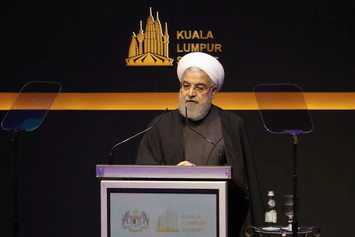 FILE PHOTO: Iranian President Hassan Rouhani speaks during Kuala Lumpur Summit in Kuala Lumpur, Malaysia, December 19, 2019. REUTERS/Lim Huey Teng/File Photo