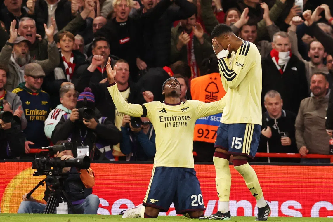 Arsenal’s Noni Madueke celebrates scoring their first goal against Nottingham Forest with Ezri Konsa on Oct 18.