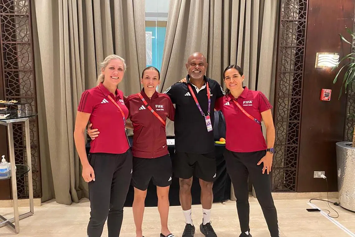 Singaporean Fifa fitness instructor M. Ganesan with the all-female officiating trio of (from left) assistant Neuza Back of Brazil, referee Stephanie Frappart of France and assistant Karen Diaz of Mexico before they made history on Thursday by presiding over Germany's 4-2 win over Costa Rica. 