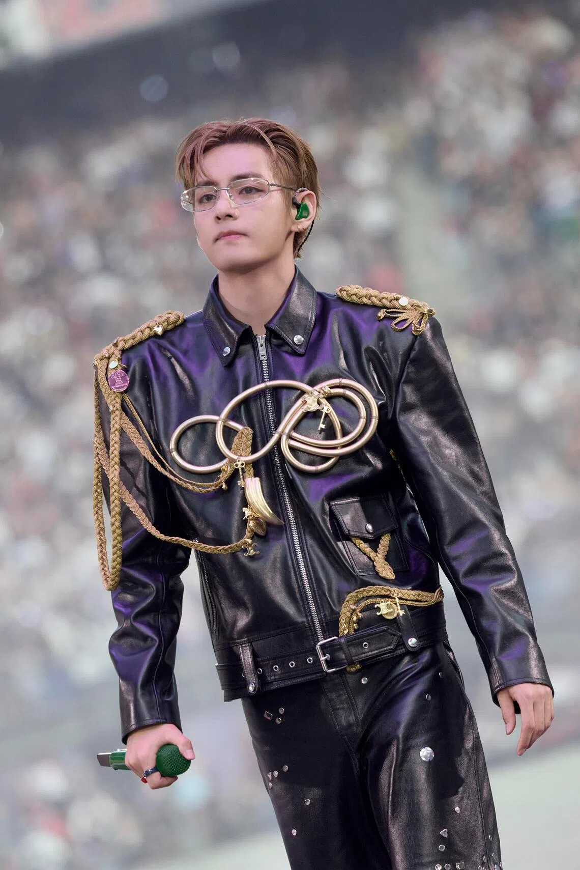 V in a custom embroidered Celine lambskin jacket and custom studded skate trousers.