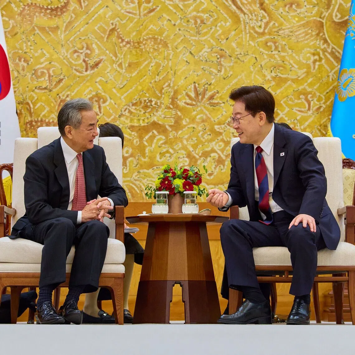 South Korean President Lee Jae Myung (right) meeting with Chinese Foreign Minister Wang Yi at the presidential office in Seoul, South Korea, on Aug 20.