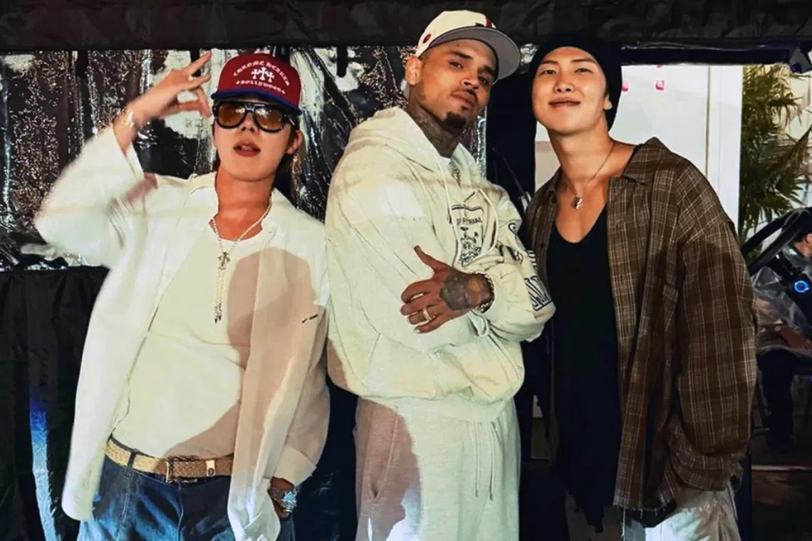 Chris Brown posted a picture with BTS leader Kim Namjoon and rapper Jung Hoseok on Aug 13.