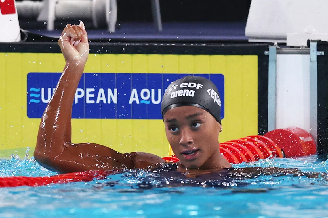 Gold medallist Italy’s Sara Curtis celebrates winning the Women’s 50m Backstroke Final and setting a new world record.