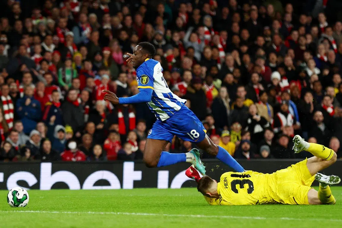 Brighton & Hove Albion's Danny Welbeck is fouled by Arsenal's Karl Hein resulting in a penalty being awarded to his side.