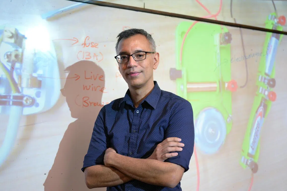 Science teacher Syed Ali Mohamed Alhabshee has significant hearing loss.