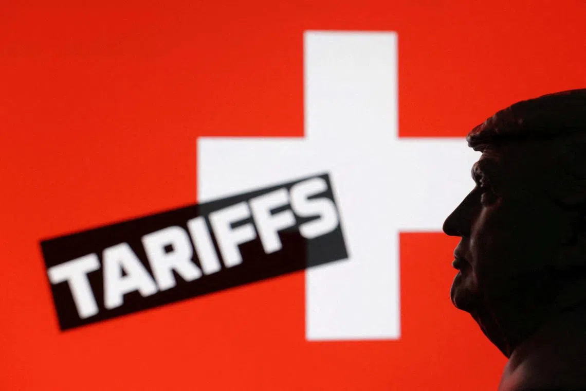 FILE PHOTO: A 3D-printed miniature model of U.S. President Donald Trump, the Switzerland flag and the word \"Tariffs\" are seen in this illustration taken July 23, 2025. REUTERS/Dado Ruvic/Illustration/File Photo