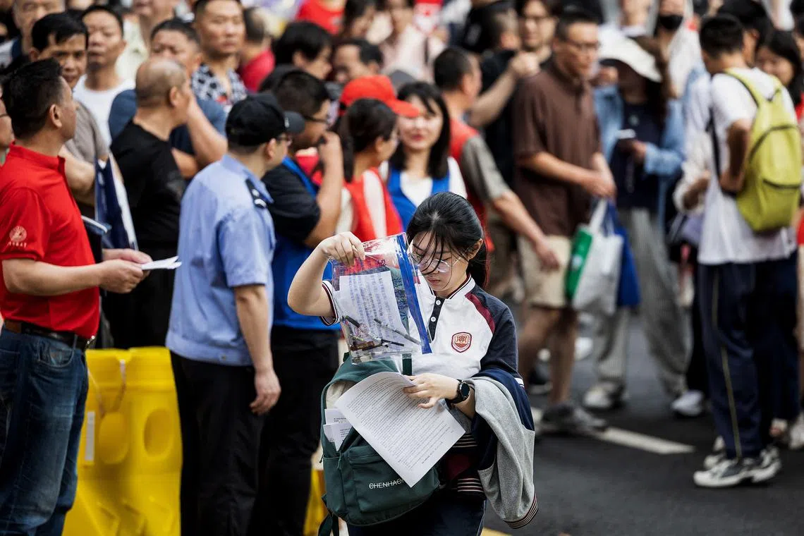 A student enters a school on the first day of the national college entrance examination, known as "Gaokao", in Wuhan, in central China's Hubei province on June 7, 2024. 