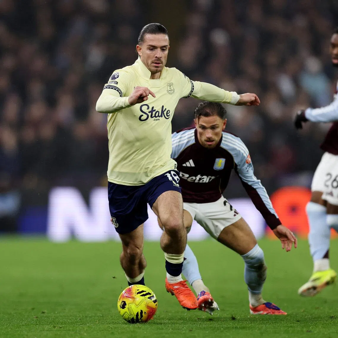 Soccer Football - Premier League - Aston Villa v Everton - Villa Park, Birmingham, Britain - January 18, 2026 Everton's Jack Grealish in action with Aston Villa's Matty Cash. REUTERS/David Klein