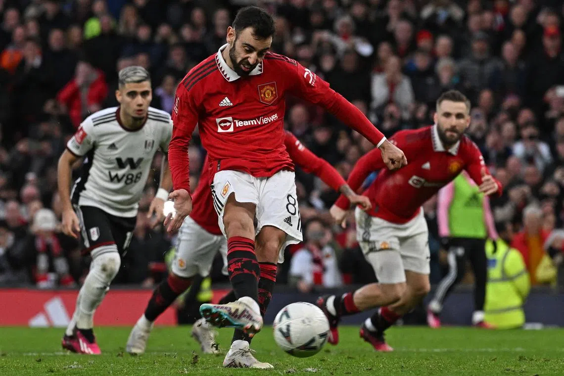 Manchester United midfielder Bruno Fernandes scoring their first goal from the penalty spot during the English FA Cup match between United and Fulham at Old Trafford.