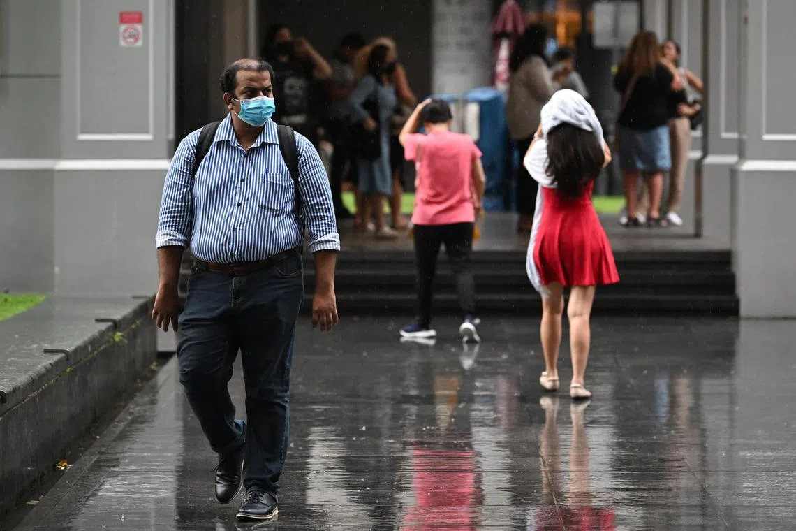 ST20221006-202242642321-Lim Yaohui-pixgeneric/

An office worker walking under the rain at Raffles Place, within the heart of Singapore's financial centre in the CBD area on Oct 6, 2022. 

The Meteorological Service Singapore (MSS) said in its bimonthly report that the total rainfall for the first two weeks of October is forecast to be above average over most parts of the island.

The showers should usually occur between the morning and early afternoon. Daily temperature on most days is expected to range between 24 deg C and 33 deg C. Rain may lower this to between 23 deg C and 32 deg C on a few days.

(ST PHOTO: LIM YAOHUI)