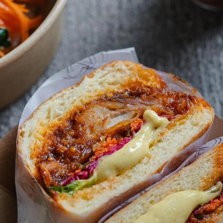 Yangnyeom Chicken Burger (left) is one of the food items Odem will be selling the Korean Craft Collective festival. Byeolsan Yuja created by Yangjudoga Brewery will be available for sale at the Korean Craft Collective..