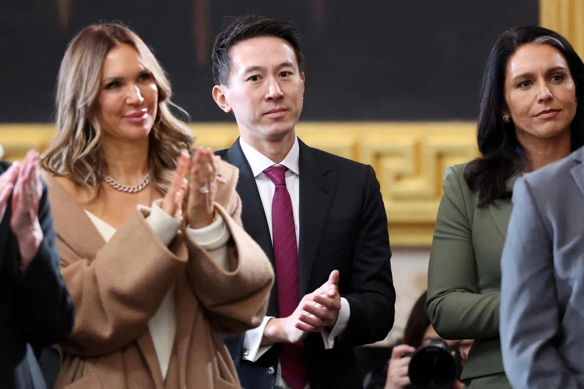 TikTok CEO Shou Zi Chew and Trump's nominee to be Director of National Intelligence (DNI) Tulsi Gabbard applaud on the day of the Presidential Inauguration of Donald Trump at the Rotunda of the U.S. Capitol in Washington, U.S., January 20, 2025. REUTERS/Kevin Lamarque/Pool