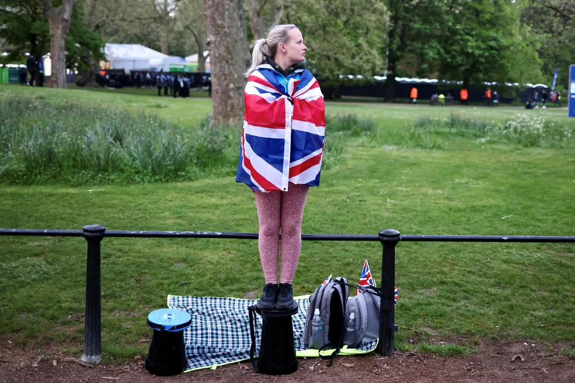 A lady waiting on The Mall, ahead of the coronation of Britain's King Charles and Queen Camilla, in London, Britain May 6.