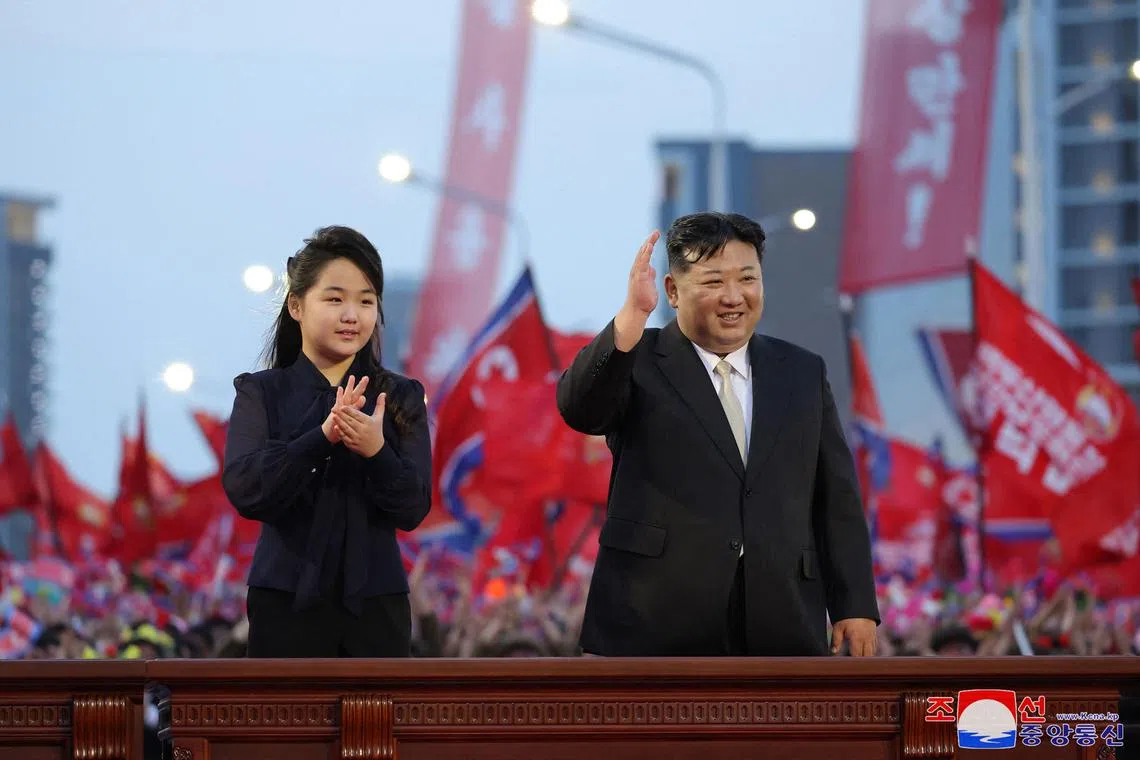 North Korean leader Kim Jong Un (right) and his daughter Ju Ae attending the inauguration ceremony of Jonwi Street in Pyongyang on May 14.