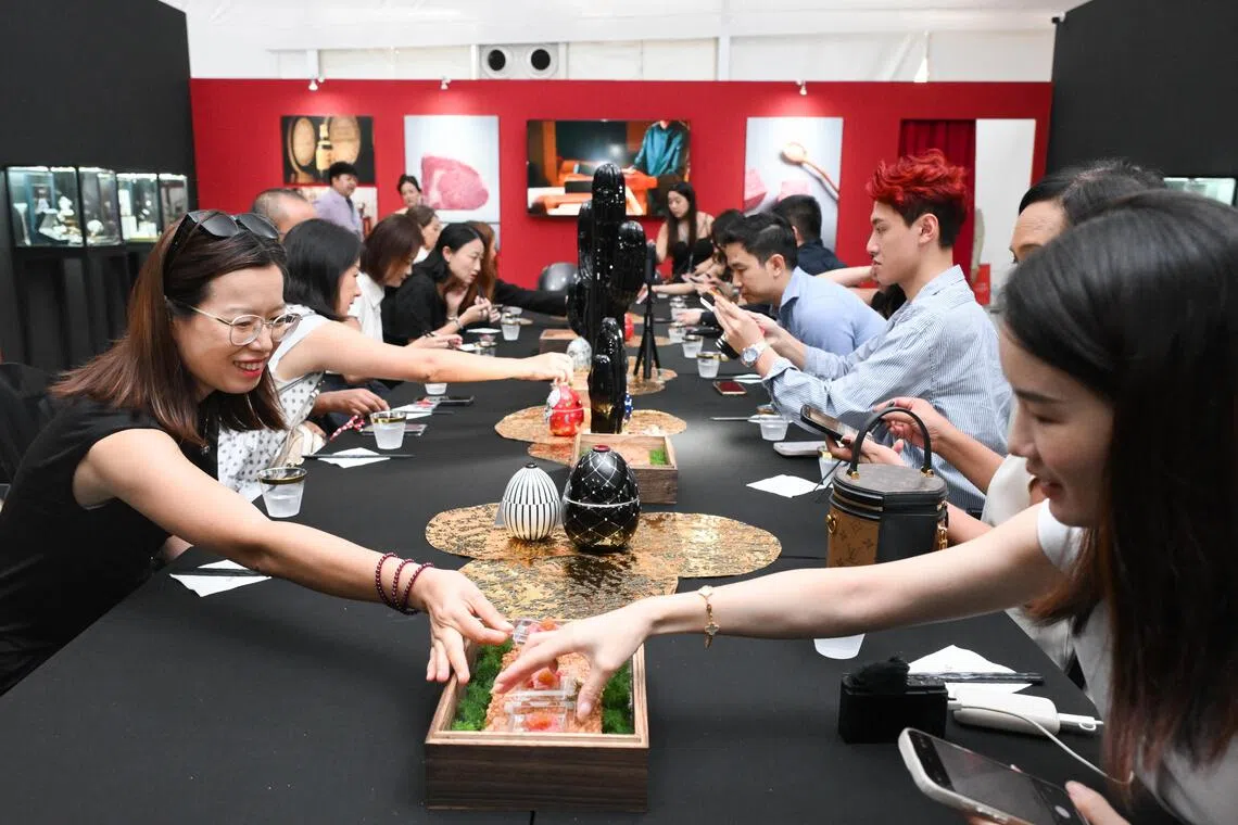 People sampling Matsusaka beef at Haute room
featured at luxury fair Ultraluxe 4th edition at a tent in front of Ngee Ann City on Oct 4, 2025.