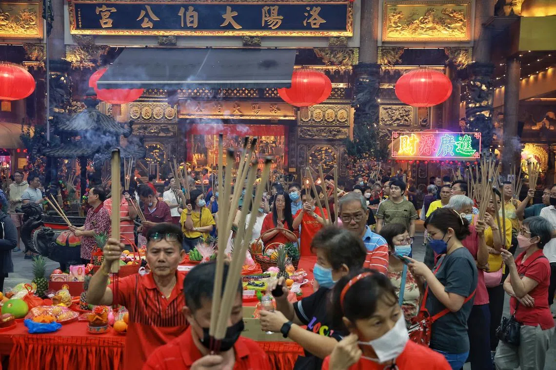 Devotees praying with their joss sticks at the celebration of the Jade Emperor’s birthday at Loyang Tua Pek Kong temple on Jan 29, 2023.