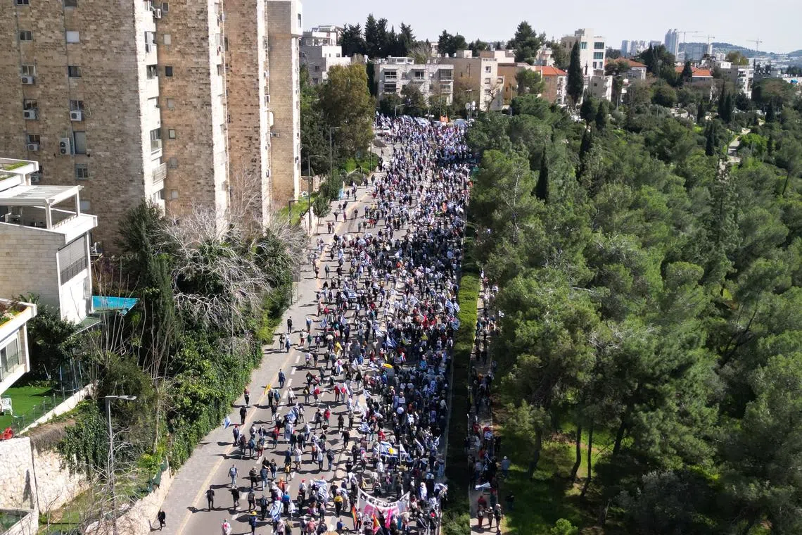 A drone view shows a protest against moves by the Israeli government to fire the Attorney General Gali Baharav Miara and the dismissal of top security agency chief, Ronen Bar, in Jerusalem, March 23, 2025. REUTERS/Ilan Rosenberg