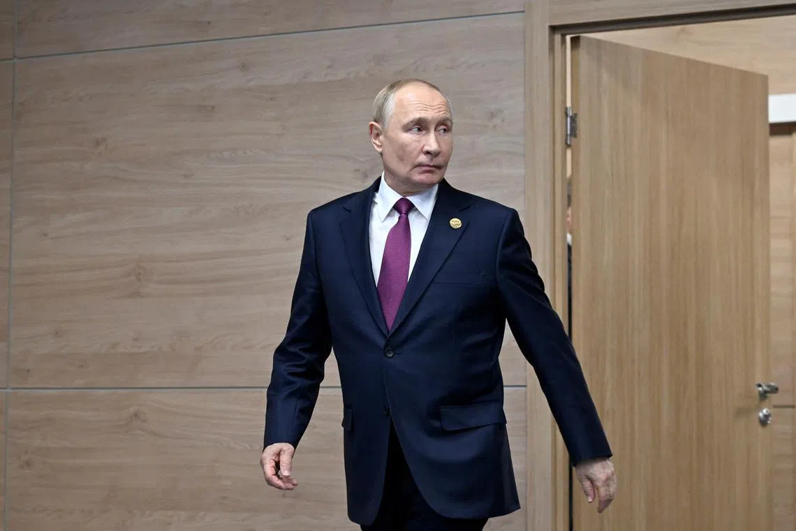 Russian President Vladimir Putin enters a hall before a meeting on the sidelines of the BRICS summit in Kazan, Russia October 24, 2024. Alexander Nemenov/Pool via REUTERS