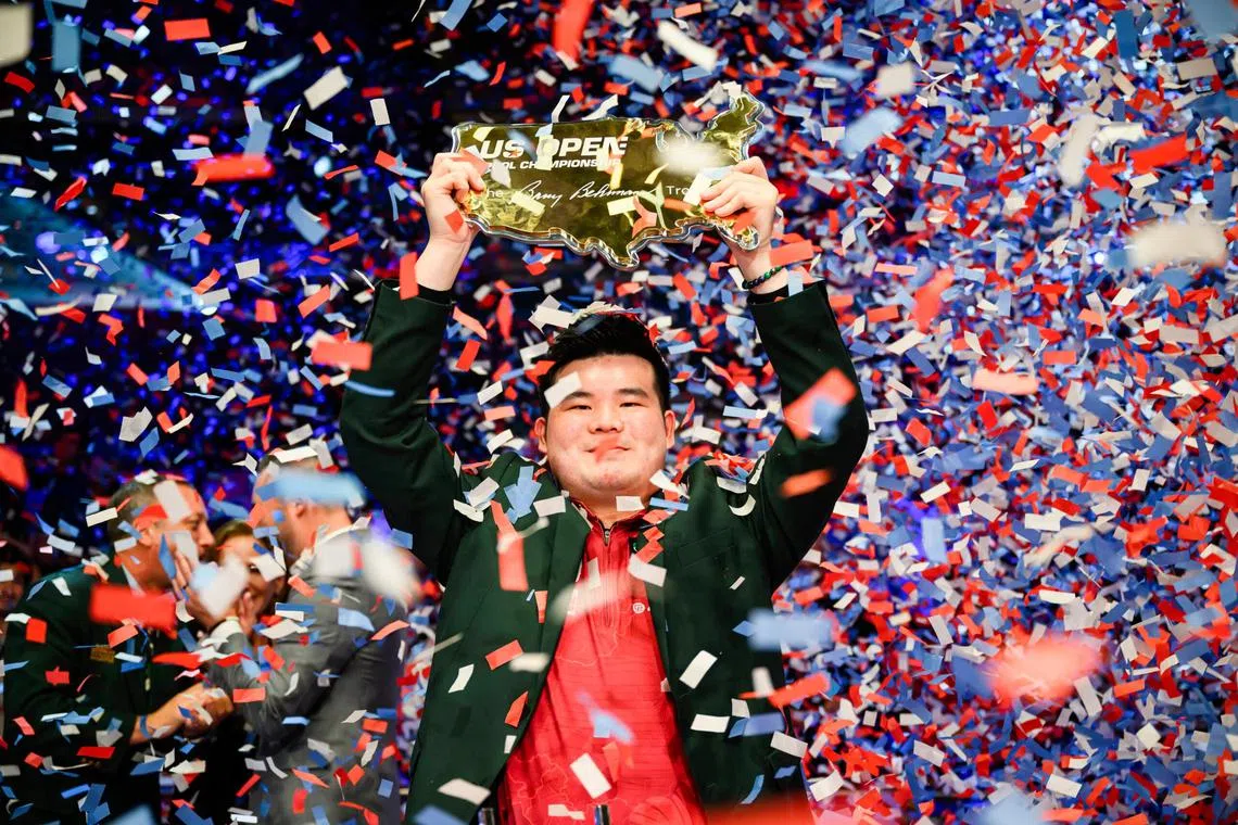 Donning the prestigious green jacket for the victor, Singapore's Aloysius Yapp lifts the US Open Barry Behrman trophy as he completes an unprecedented three consecutive Matchroom major titles on Aug 23.