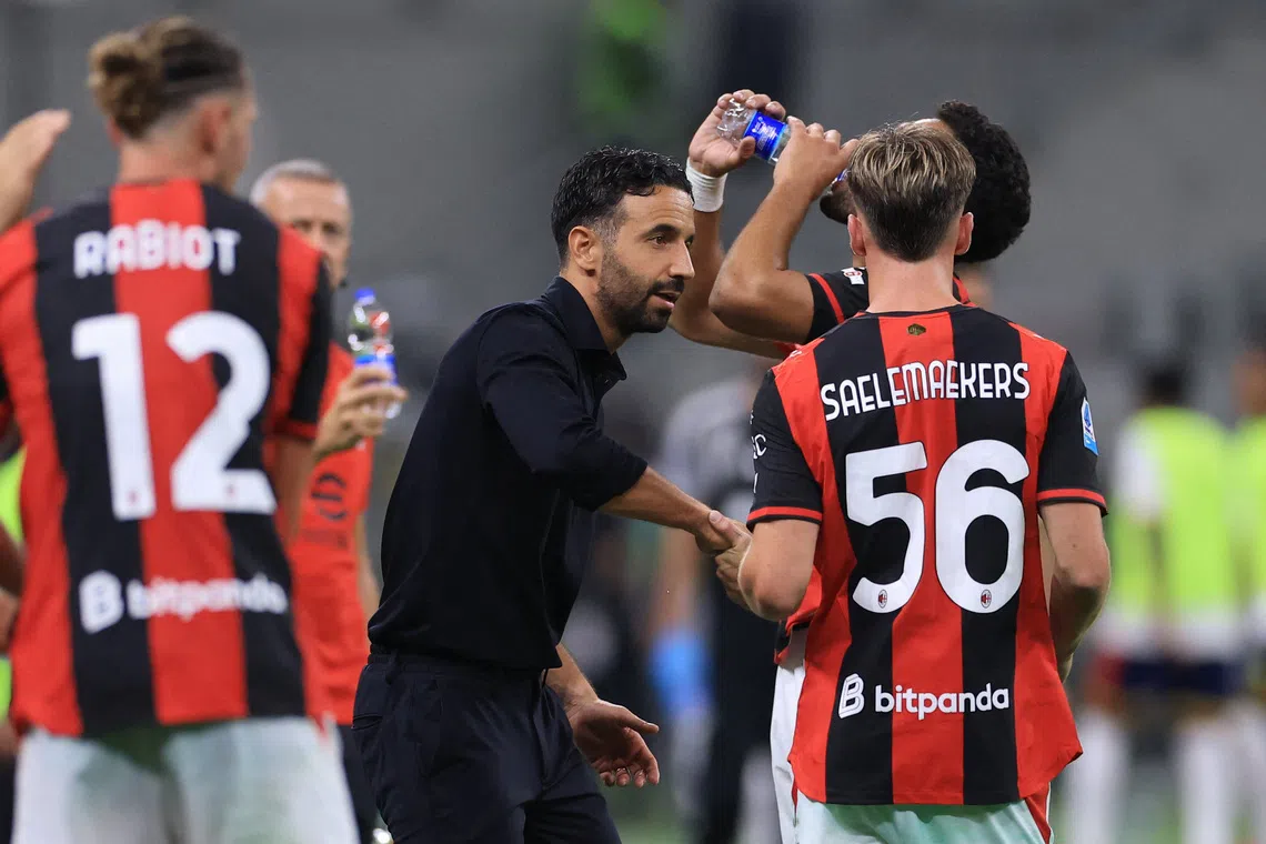 Soccer Football - Serie A - AC Milan v Lecce - San Siro, Milan, Italy - September 20, 2026 AC Milan coach Ruben Amorim with AC Milan's Alexis Saelemaekers during the match REUTERS/Claudia Greco