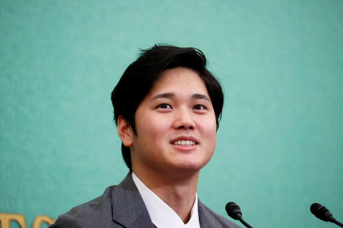 FILE PHOTO: Japanese two-way baseball player for the Los Angeles Angels Shohei Ohtani attends a news conference at the Japan National Press Club in Tokyo, Japan November 15, 2021.  REUTERS/Issei Kato/File Photo