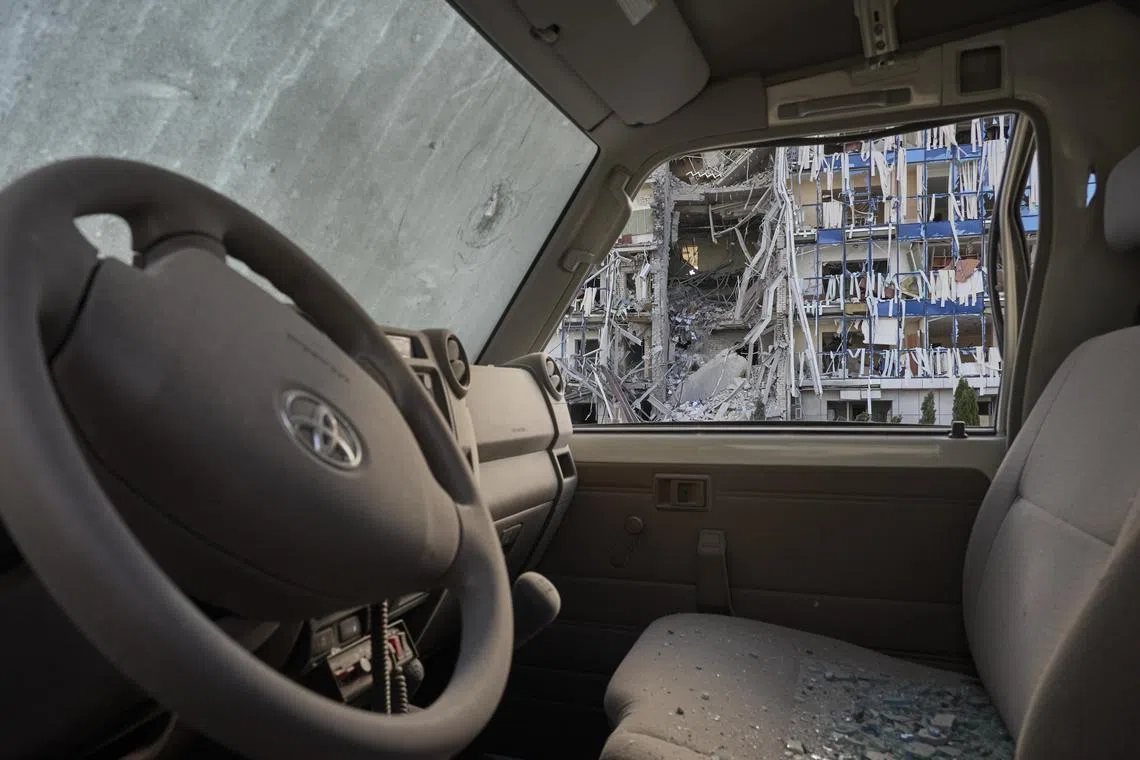 Debris inside a car at the offices of the Swiss Foundation for Mine Action, after Russian missile attacks on Kharkiv, northeastern Ukraine.