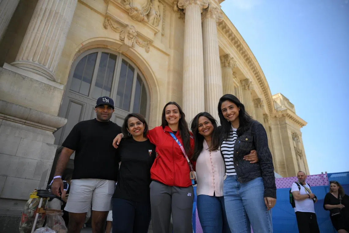 Singaporean fencer Amita Berthier (centre) pictured with her mother Uma (second from left) and siblings, from left, Ashok, Aishwarya and Aarya, in front of the Grand Palais after her bout at the Paris Olympics. 