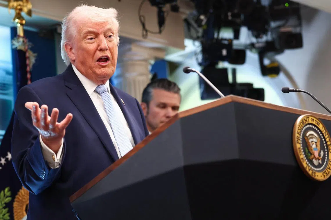 U.S. President Donald Trump, flanked by Secretary of Defense Pete Hegseth, speaks during a press conference in the James S. Brady Press Briefing Room at the White House in Washington, D.C., U.S., April 6, 2026. REUTERS/Kevin Lamarque